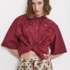 Blouse en coton avec broderie à oeillets